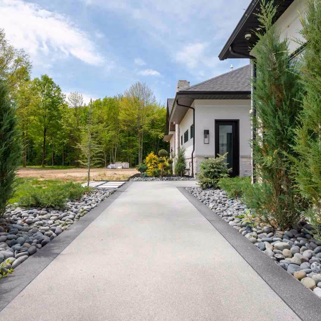 A nice modern home with a driveway, freshly seallcoated